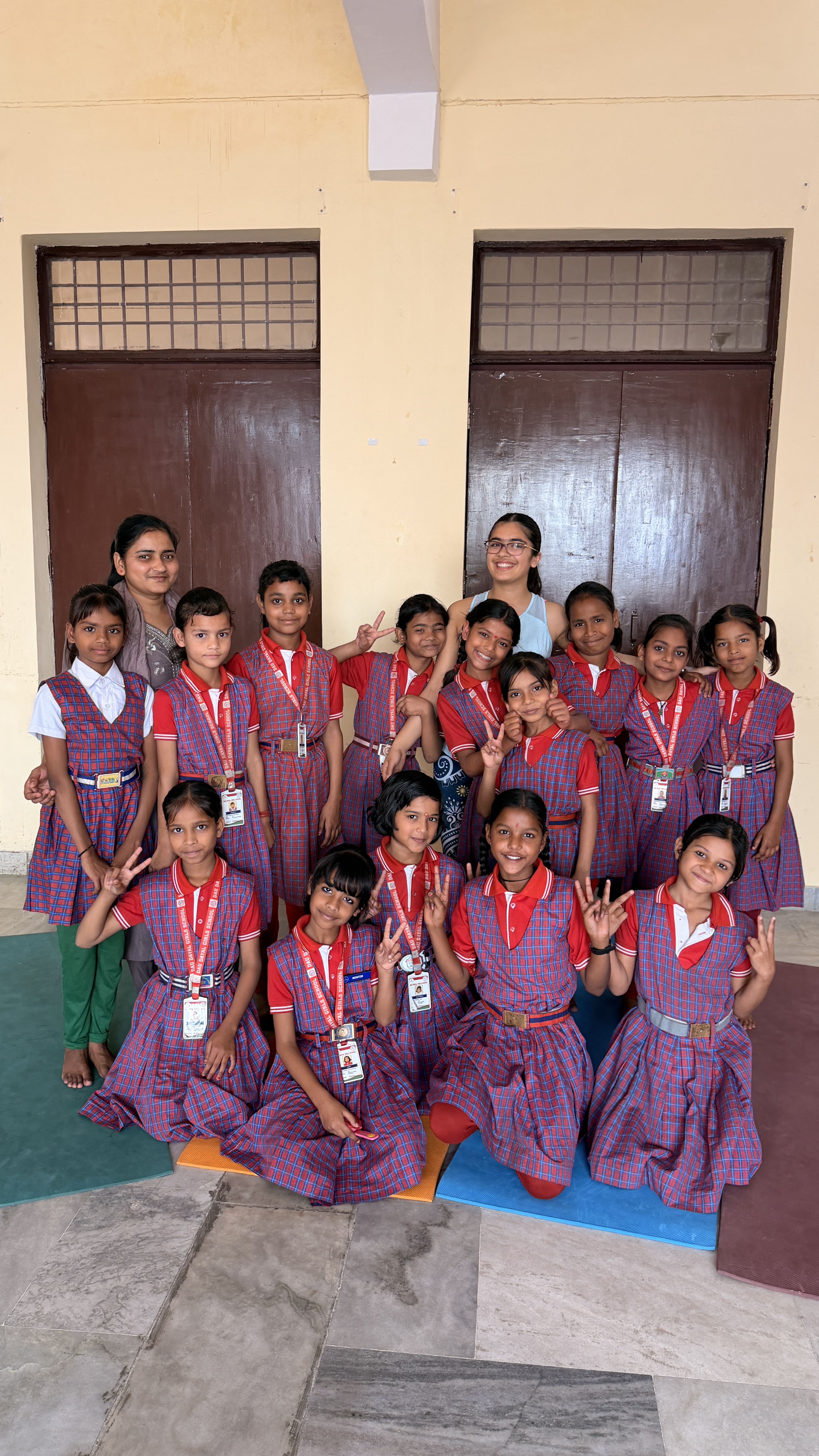 Youth for Yoga team member sharing a joyful hug with students at the end of the India trip