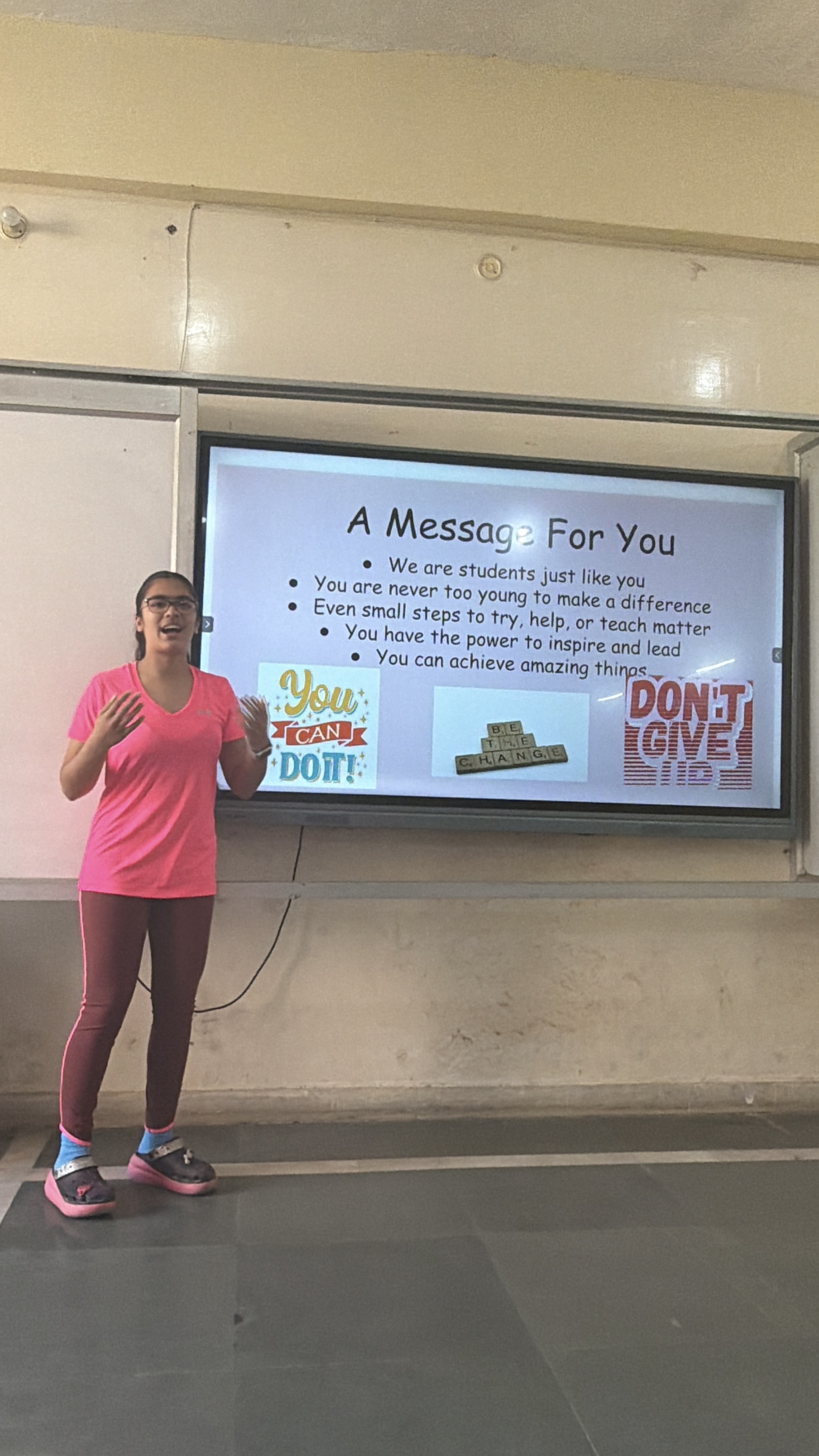 Youth for Yoga team member talking with students in Ferozabad before the yoga session begins