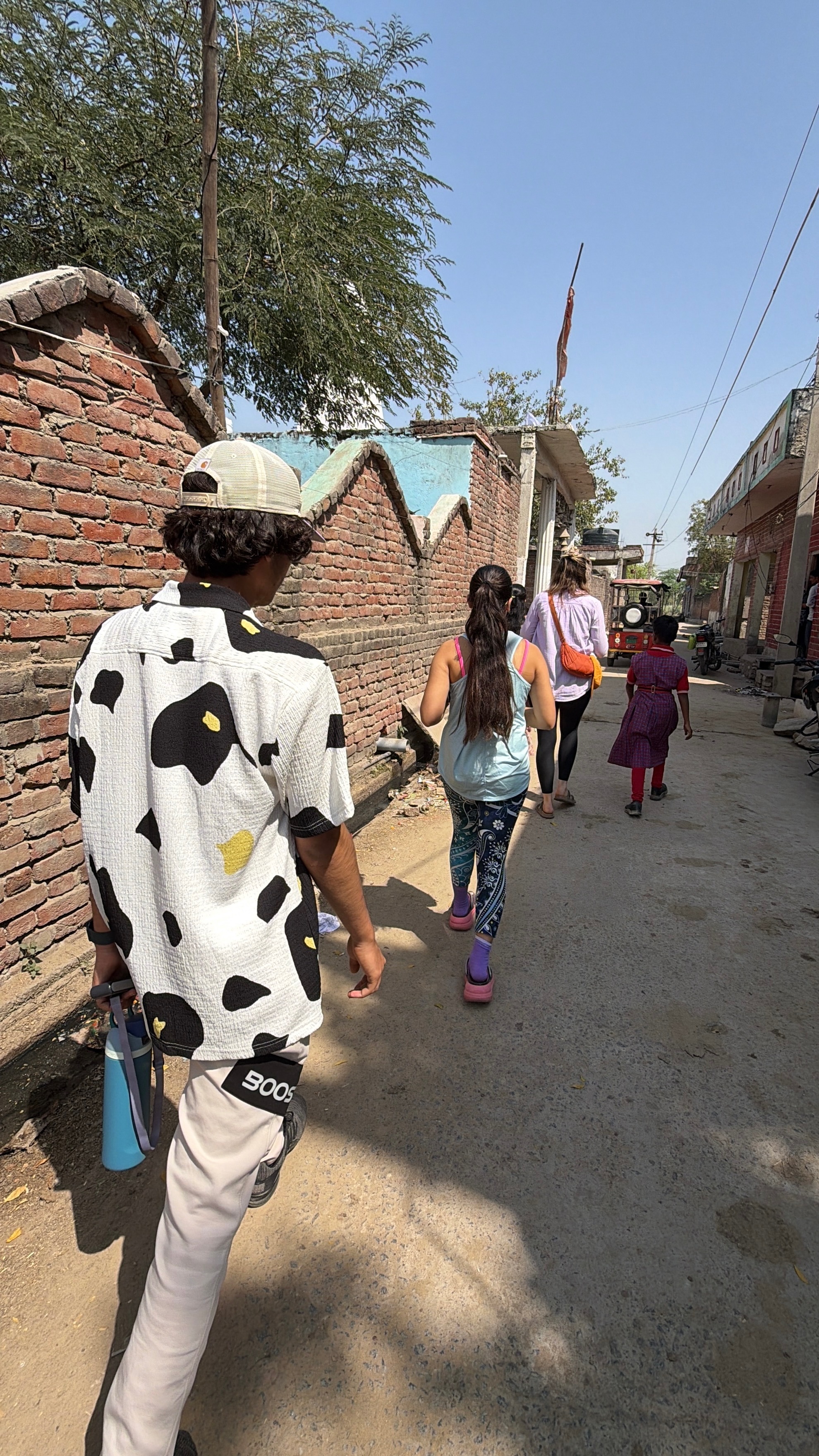 Youth for Yoga team visiting a student's home in Ferozabad — meeting the family