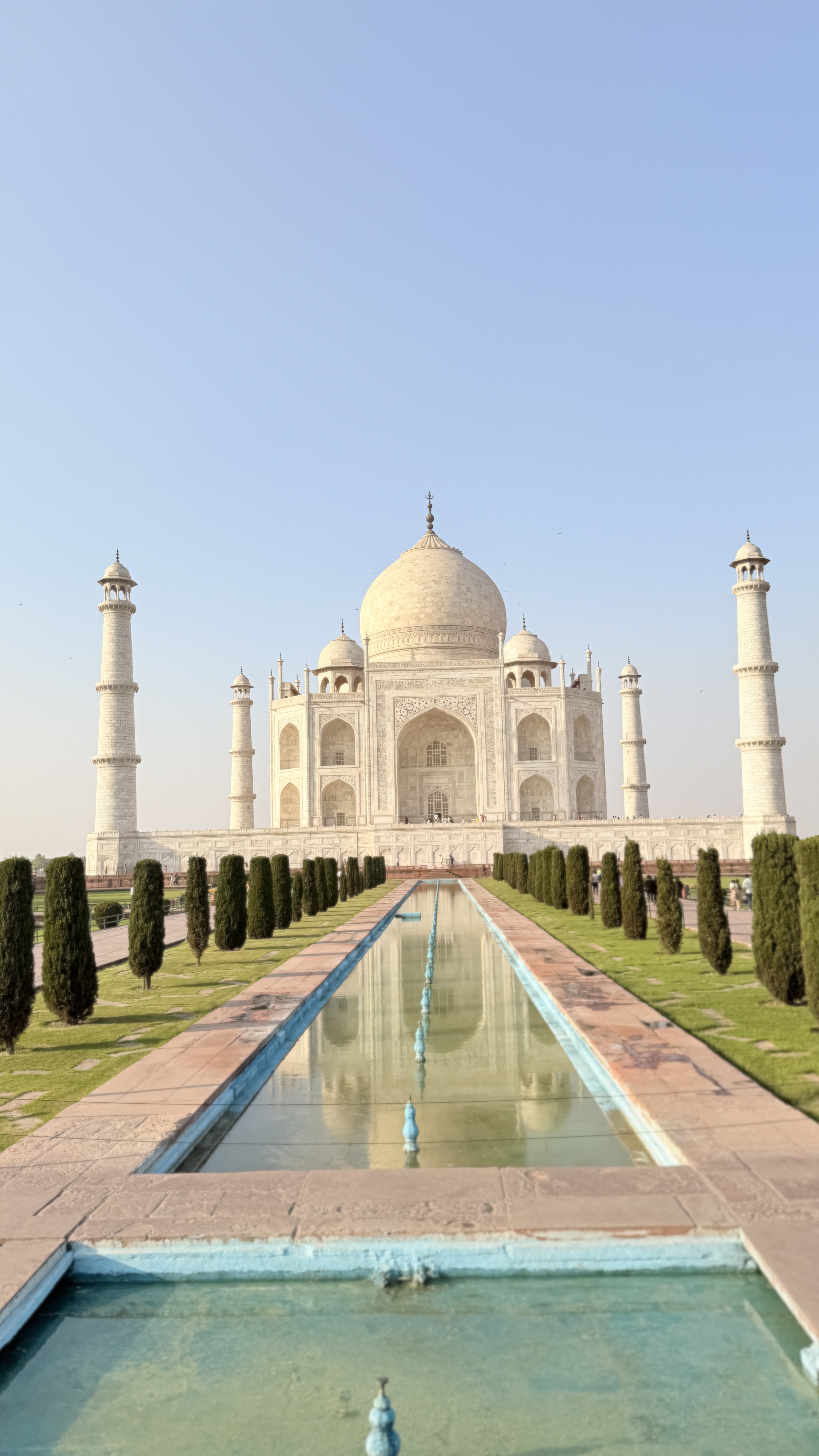 Youth for Yoga team at the Taj Mahal — reflecting pool and marble mausoleum