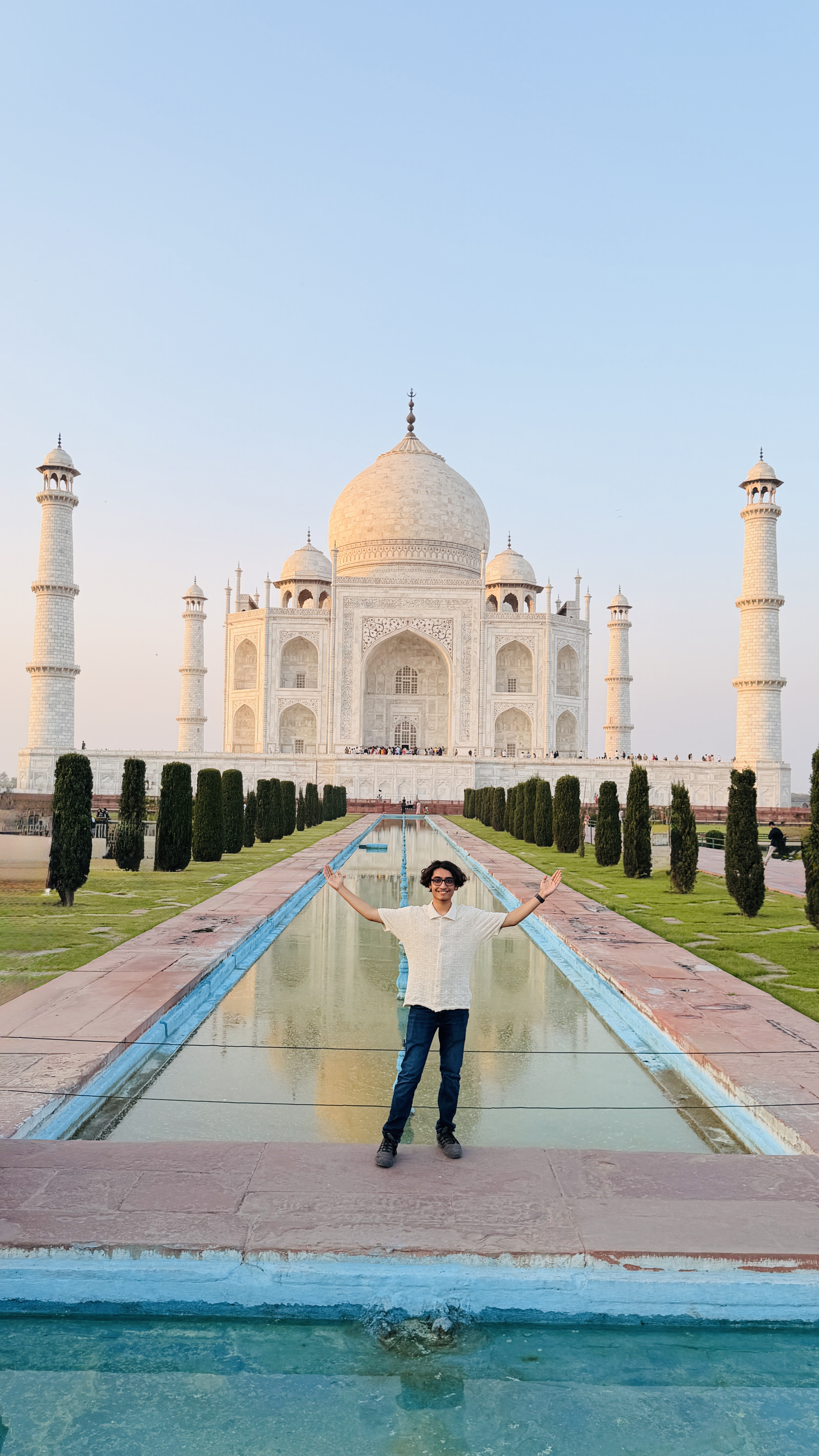 Youth for Yoga team with the Taj Mahal in the background — Agra, India 2026